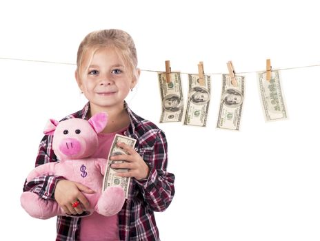 children and money. Girl hanging dollar bills on a rope isolated on white