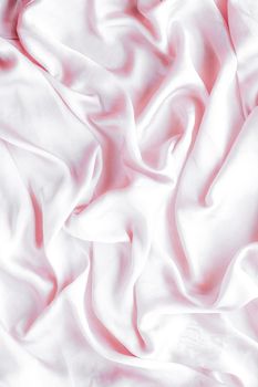 Elegant fabric texture, abstract backdrop and modern pastel colours concept - Pink soft silk waves, flatlay background