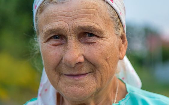 Beautiful portrait of an old woman. Selective focus. People.