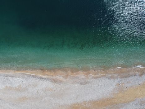 Aerial panoramic view of beautiful sunset above sea. Beautiful seascape. Sun glare, small waves on the water surface. Evening. Horizon. Nobody. No people. Copy space. Never-ending beauty of nature