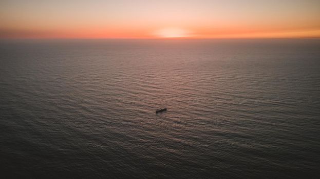 Aerial view os ship in middle of the ocean. High quality photo