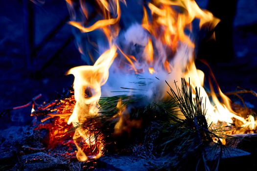 a large open-air fire used as part of a celebration, for burning trash, or as a signal.