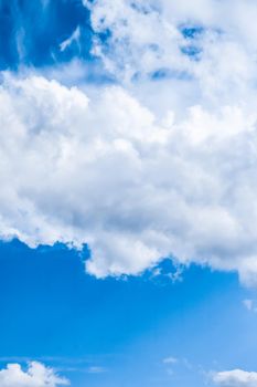 Nature backdrop, solar energy and spiritual concept - Blue sky background, white clouds and bright sunlight