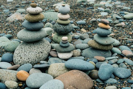 Stones stacked one by one, balancing rocks on the seashore. Balancing stones on the seashore