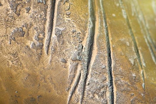 Bronze texture for backgrounds. Grunge metal background close-up. Selective focus