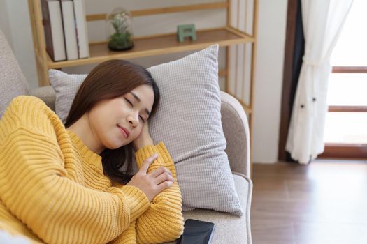 woman resting on the sofa at home.