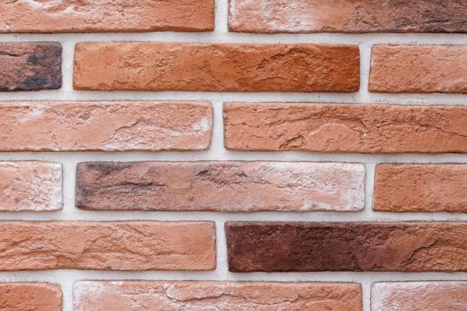 artificial brick wall, plastic panel imitating natural brickwork with white seams