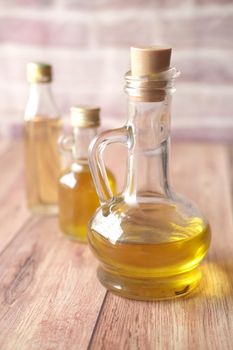 bottle of olive oil on table .