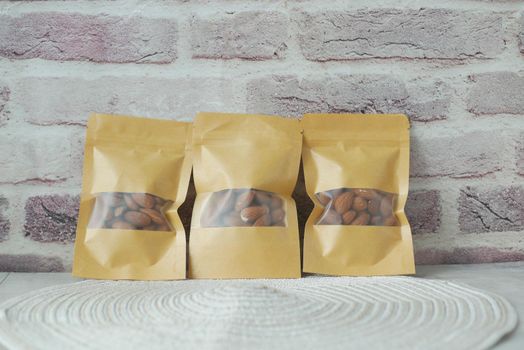 almond nuts in a packet on table .