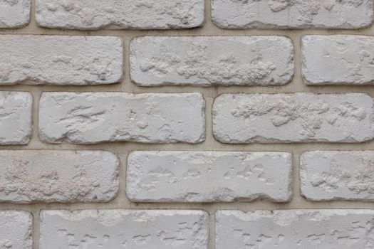 artificial white brick wall, plastic panel imitating natural brickwork