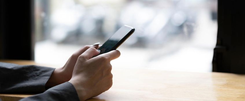 woman using apps on a mobile touchscreen smartphone. Concept for using technology, shopping online, mobile apps, texting, addiction