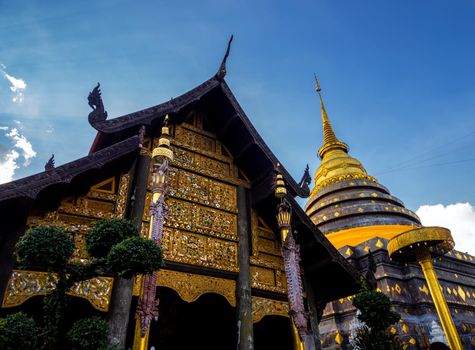 Northern Thai art patterns on various parts of the chapel and pagoda in the temple