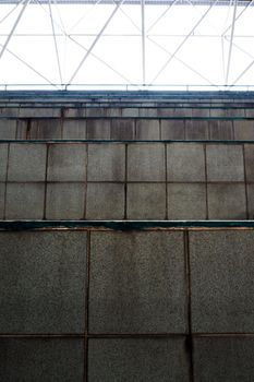 The old surface of floor tile on the concrete seat in the stadium