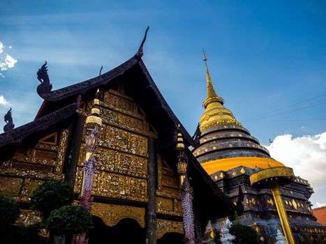 Northern Thai art patterns on various parts of the chapel and pagoda in the temple