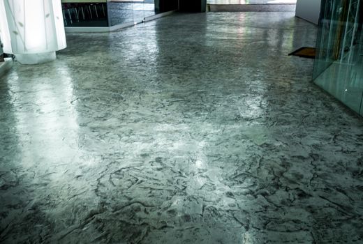 Surface texture on concrete flooring, polished and varnished of the corridor floor in the building