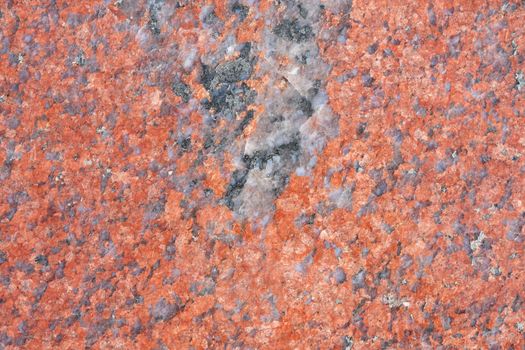 Background texture of polished red granite, close-up.. Abstract granite background for design