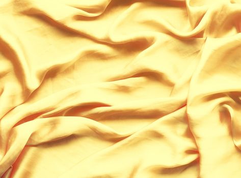 Luxury golden silk background texture - elegant fabric textures, abstract backgrounds and modern pastel colours concept