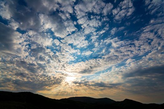 Beautiful sunset sky clouds with dramatic light. Greece.