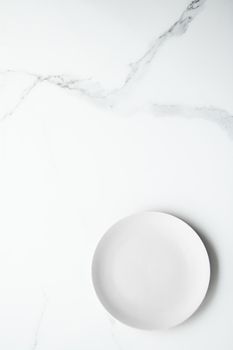 White empty plate on marble, flatlay - stylish tableware, romantic table decor and food menu concept. Serve the perfect dish