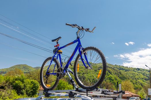 Bicycle roof mount. Transportation of mountain bikes on the roof of the car. 