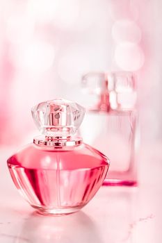 Perfume bottles on glamour background, floral feminine scent, fragrance and eau de parfum as luxury holiday gift, cosmetic and beauty brand present concept