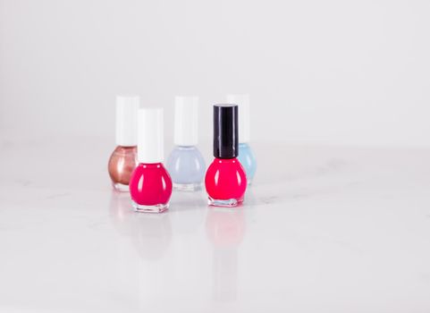 Beauty, make-up and cosmetics concept - Nail polish bottles, manicure and pedicure collection