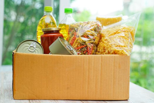 Foodstuffs in donation box for volunteer.