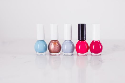 Beauty, make-up and cosmetics concept - Nail polish bottles, manicure and pedicure collection