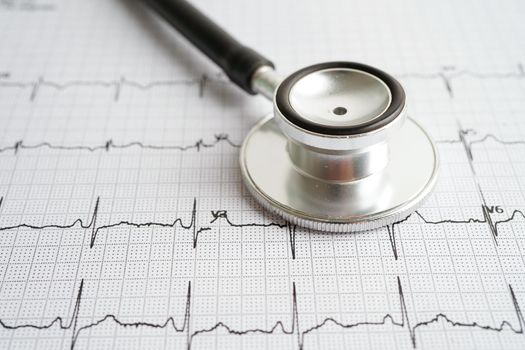 Stethoscope on electrocardiogram (ECG) with drug, heart wave, heart attack, cardiogram report.