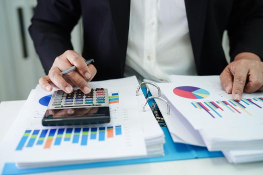 Business woman working and analysis with statistic graph in office. 