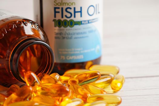 Fish oil or Cod liver oil gel in capsules with omega 3 vitamins, supplementary healthy food