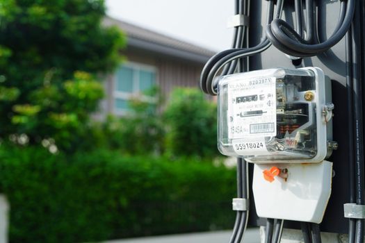 Bangkok, Thailand - May 15, 2022 Electric measuring power meter for energy cost at home and office.
