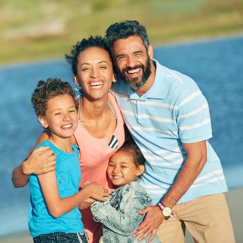 Nothing beats beach vacations. a family of four enjoying a day at the beach