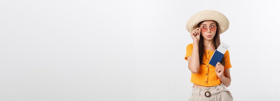 Portrait of happy tourist woman holding passport on holiday on white background