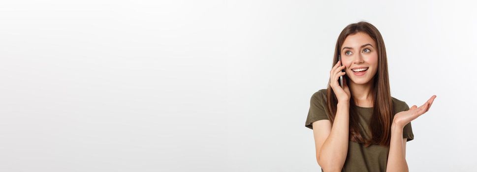 Laughing woman talking and texting on the phone isolated on a white background