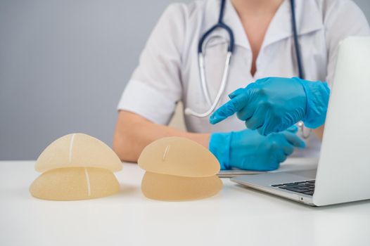 Doctor plastic surgeon explains the benefits of different breast implants