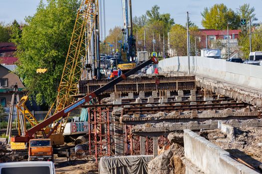 Bridge reconstruction process at summer day in Tula, Russia - April 23, 2022. Telephoto narrow angle view.