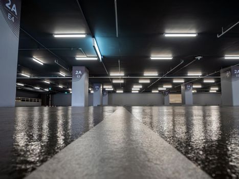 Clean and glossy flooring of the Parking lot in the parking building