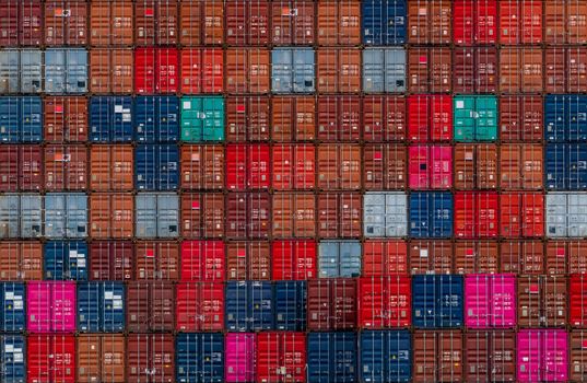 Stack of logistics container. Cargo and shipping business. Container ship for export logistics. Logistic industry. Container for truck, ship, and air logistics. Container depot service and transport.