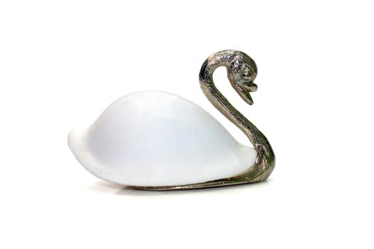 Image of swan sculpture with white shells(Ovula ovum) as part of its body. isolated on white background. Home decoration.