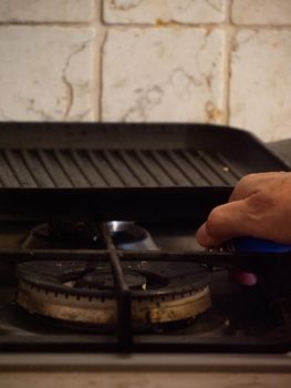 preparing a grill for cooking with heat and olive oil