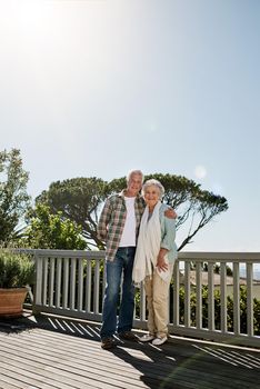 The days just keep getting better and better. a happy senior couple relaxing together on the patio at home