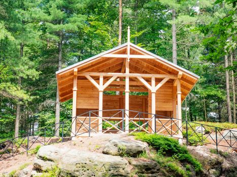 Morning sun shinning on the picnic and tourists shelter in popular Czech Switzerland park, Czech Republic.