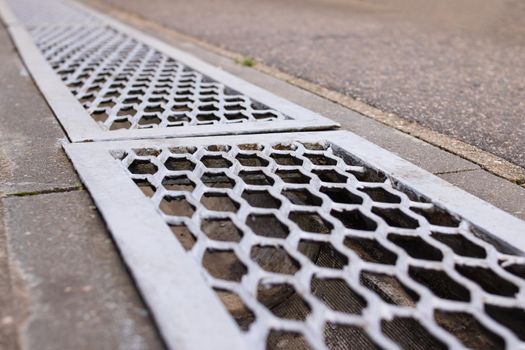 Stormwater storm on the tile road close up
