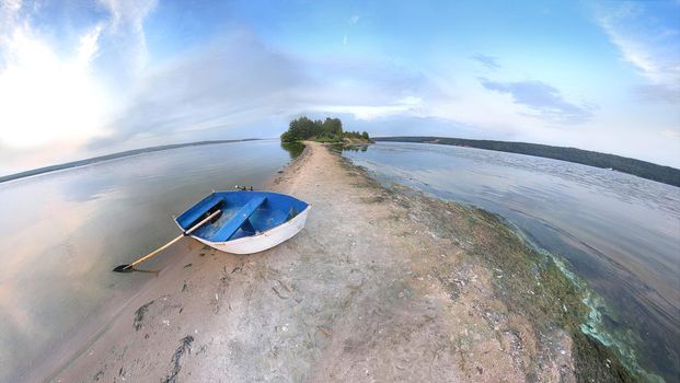 Blue rowing Boat on coastline in Volga River. Travel Landscape of Summer Vacation on Nature.