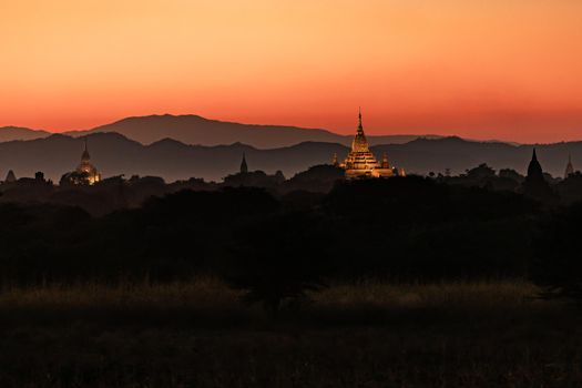 The romantic sunset behind the mighty temples of the World Heritage Site of Bagan in Myanmar