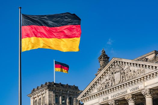 The German flag in front of the Reichstag in Berlin as symbol of separation of powers