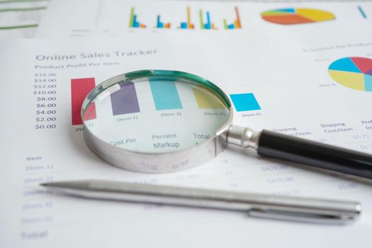 Magnifying glass on charts graphs paper. Financial development, Banking Account, Statistics, Investment Analytic research data economy.