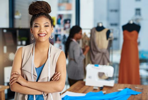 Do feed your passion. a young fashion designer posing in her workshop