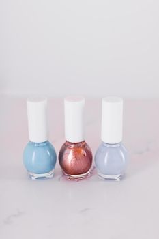 Beauty, make-up and cosmetics concept - Nail polish bottles, manicure and pedicure collection